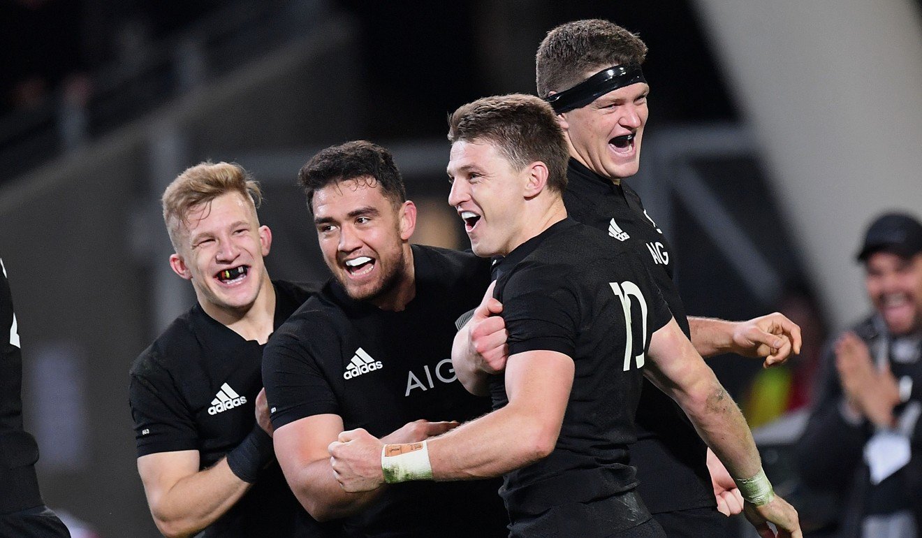 New Zealand's Beauden Barrett (front) celebrates a try with teammates Damian McKenzie (left), Anton Lienert-Brown and Scott Barrett (right).
