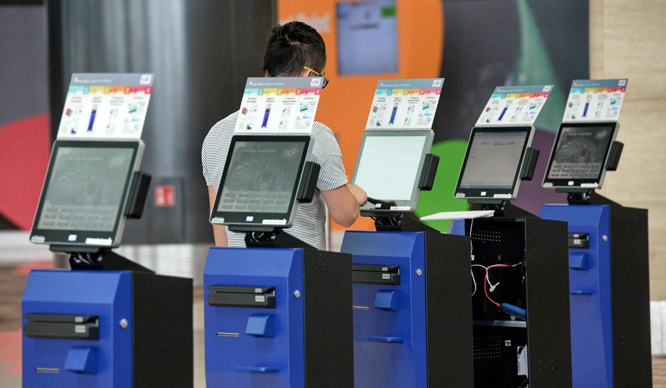 Automated check-in machines during a media tour of the newly built Changi airport terminal four in Singapore. Photo: AFP