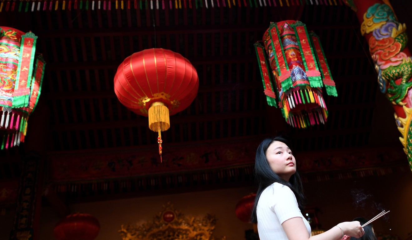 An ethnic Malaysian-Chinese girl at the Guan-Di Temple in Kuala Lumpur. Photo: AFP