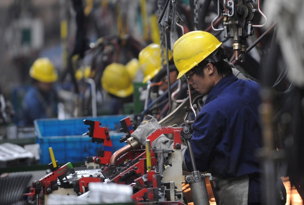 Workers on the assembly line at Geely Auto’s Ningbo factory in Zhejiang province on Dec. 6, 2011. Geely bought Volvo from Ford Motor Co. for US$1.8 billion. Photo: Xinhua/Han Chuanhao