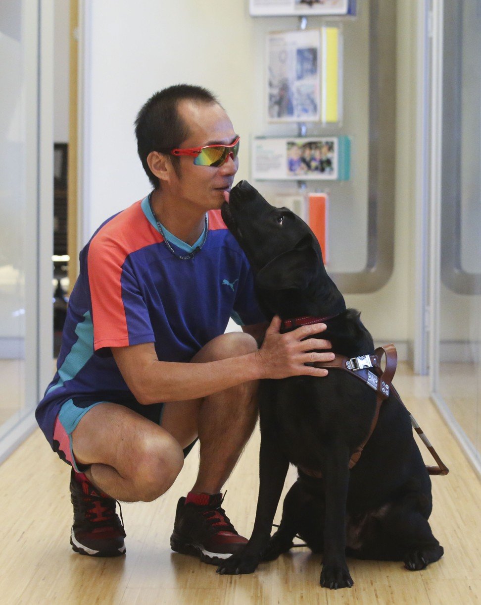 Gary Leung and his guide dog Gaga. Photo: K. Y. Cheng
