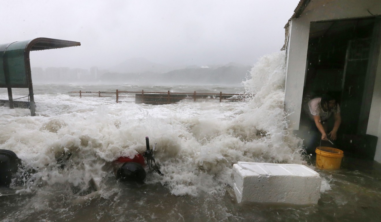 The Lei Yue Mun waterfront is battered by surging waves, flooding coastal houses. Photo: Sam Tsang
