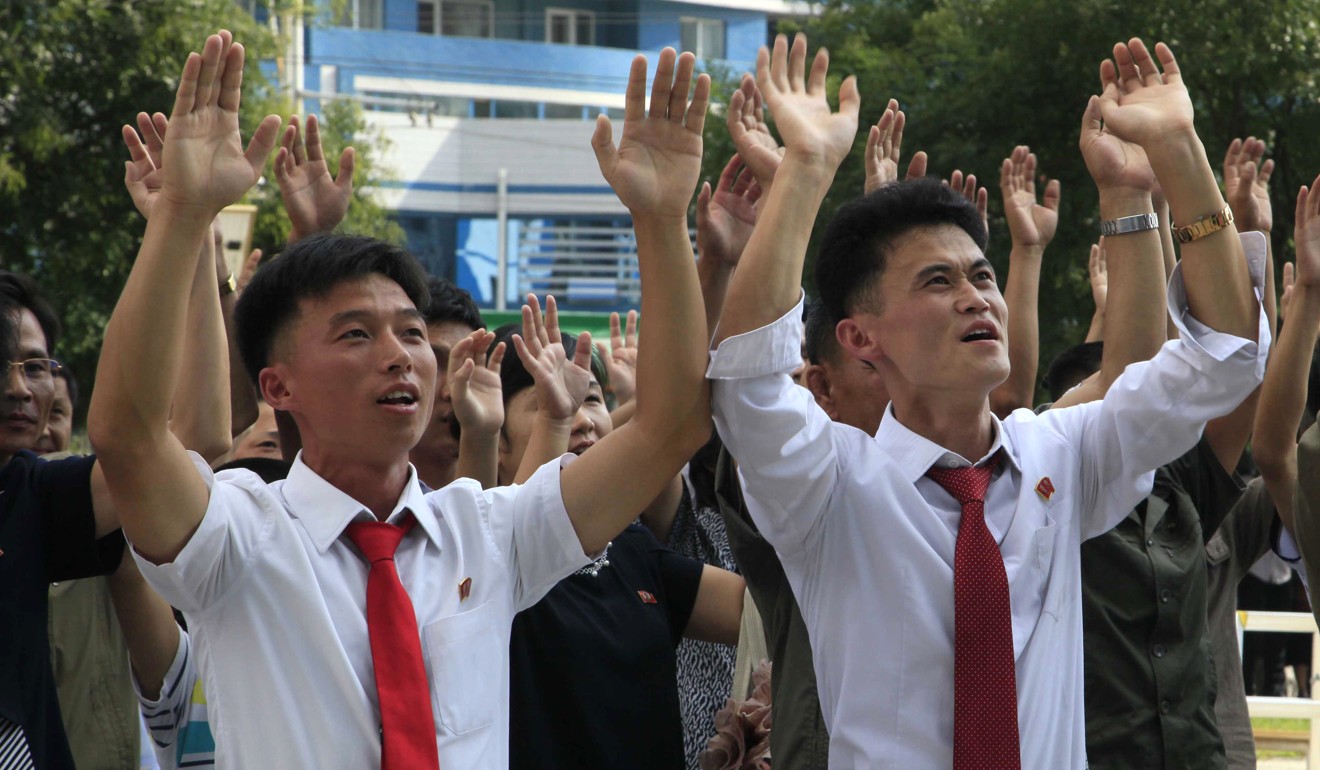 North Koreans in Pyongyang react to the news of their country's latest nuclear test. Photo: AP