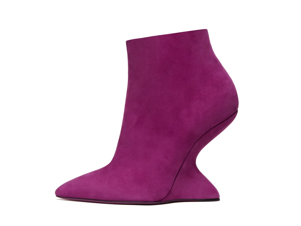 This purple ankle bootie features sleek pointy toes and undercut heels with the classic Ferragamo F wedge.