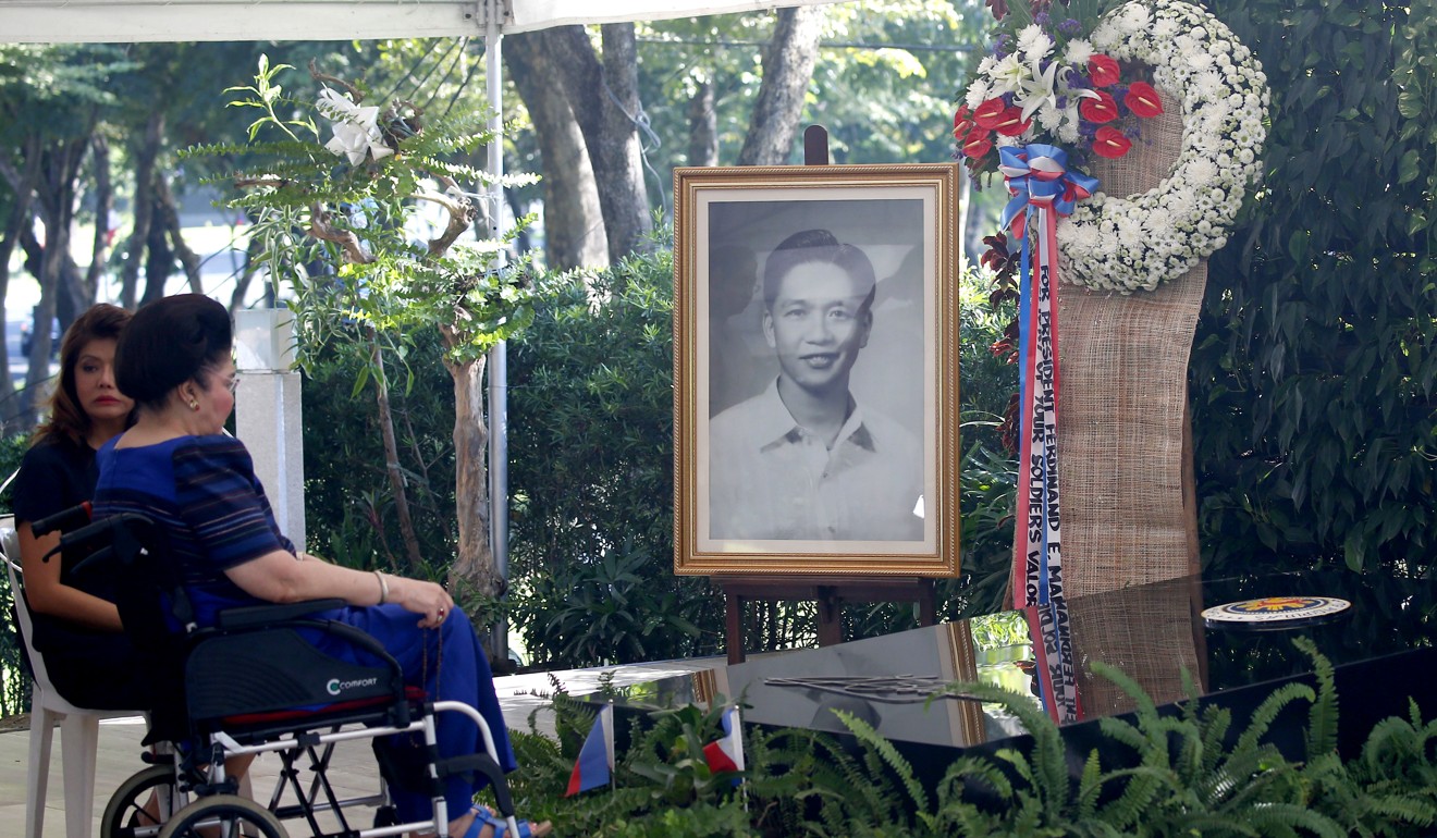 Former first lady and congresswoman Imelda Marcos chats with her daughter Imee, governor of northern Ilocos Norte province, at the grave site of her late husband and former dictator Ferdinand Marcos, on August 28. Photo: AP