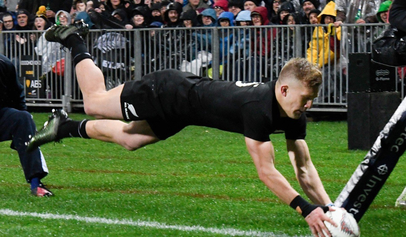 New Zealand’s Damian McKenzie goes over for a try. Photo: AFP
