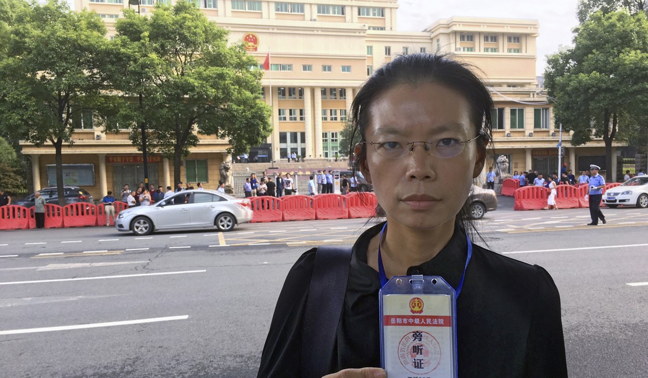 Lee Ching-yu, wife of Lee Ming-che, pictured outside the court in Hunan where his trial was held. Photo: AP