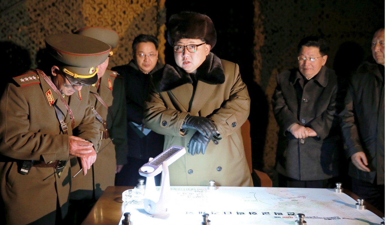 North Korean leader Kim Jong-un talks with officials at the ballistic rocket launch drill of the Strategic Force of the Korean People’s Army at an unknown location, in this undated photo released by North Korea’s Korean Central News Agency in March 2016. Photo: Reuters/KCNA