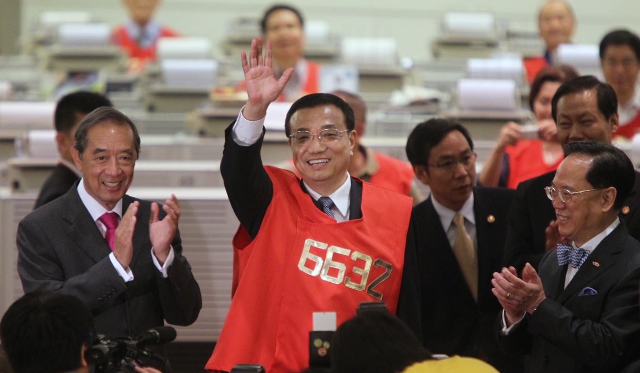China’s then vice-premier, Li Keqiang, in his red jacket during a visit to the Hong Kong exchange in 2011. Photo: David Wong
