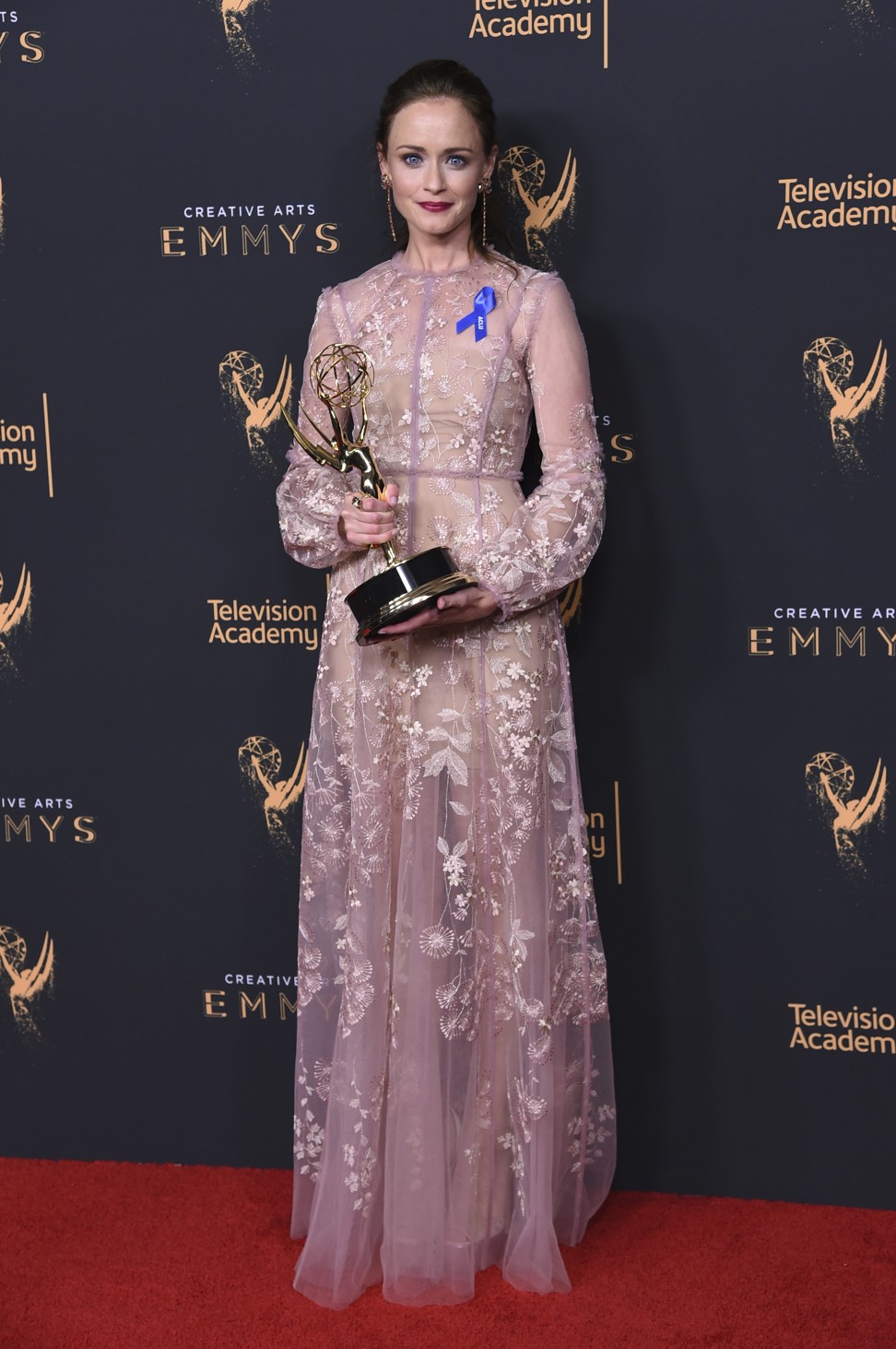 Alexis Bledel poses in the press room with the award for outstanding guest actress in a drama series for ‘The Handmaid's Tale’ during night two of the Creative Arts Emmy Awards. Photo: AP