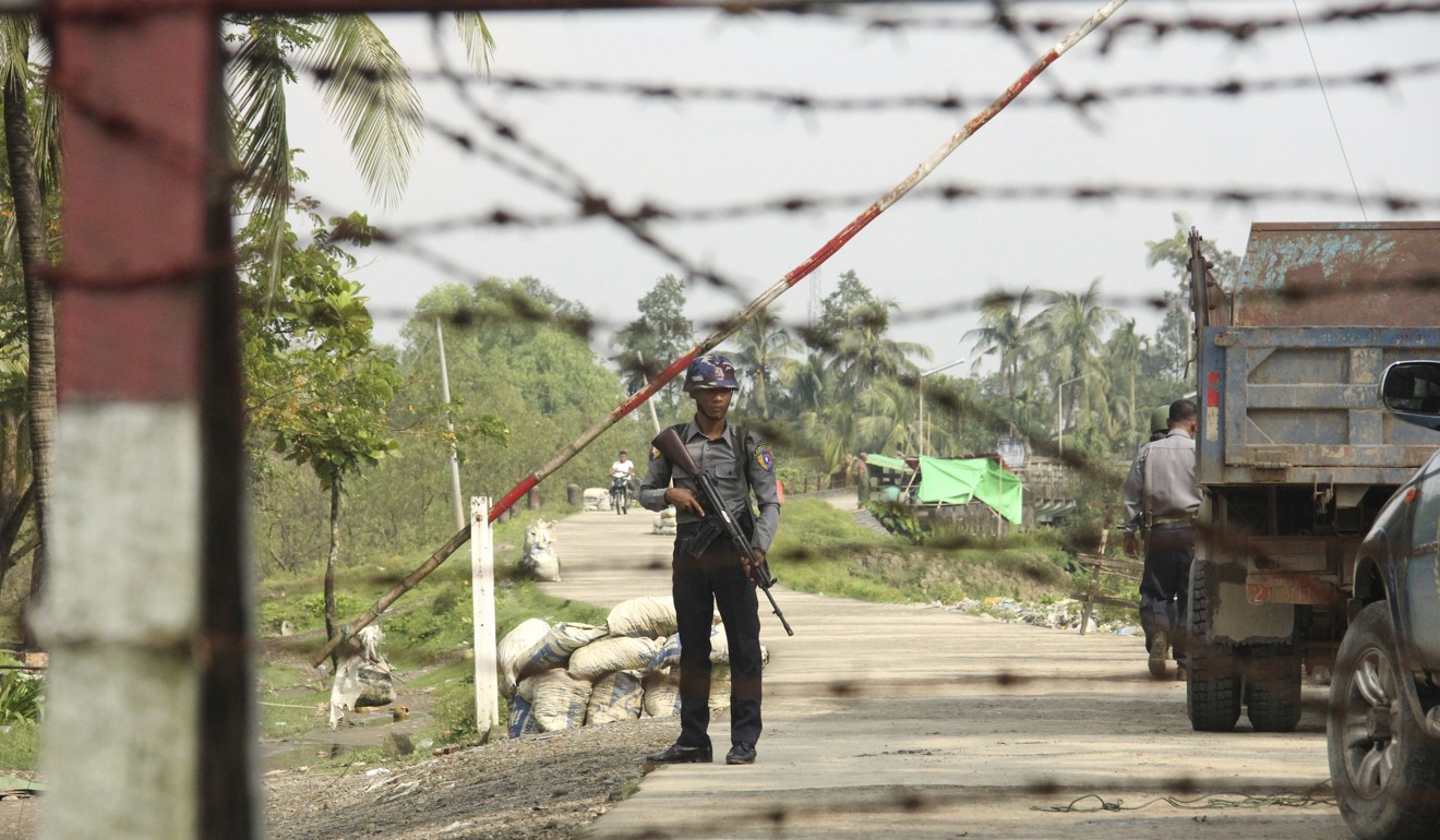 A Myanmar police officer in the village of Shwe Zar, a suburb of Maungdaw township, in the northern part of Myanmar's Rakhine state. Photo: AP