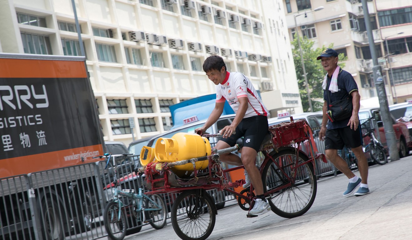 Wong Kam-po on Uncle Hung's bike.