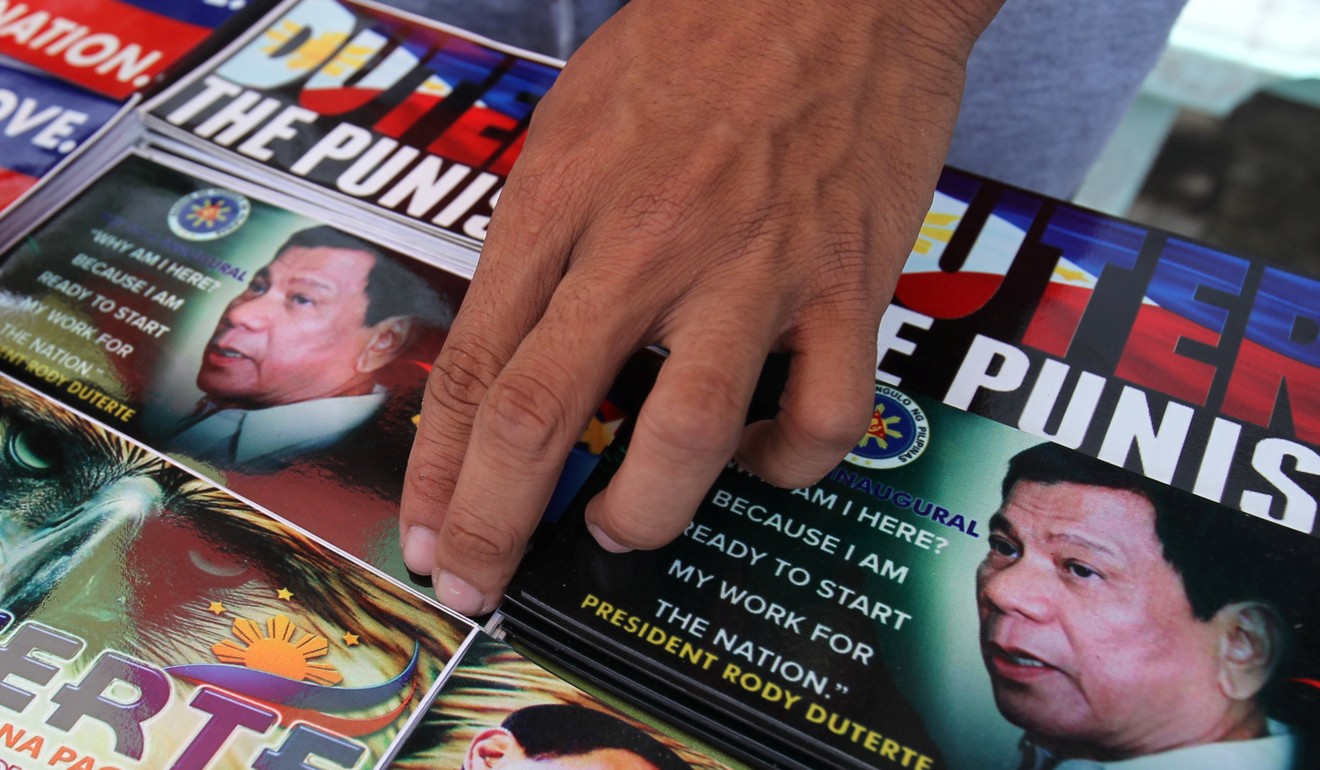 A vendor sells souvenir items with images of ‘The Punisher’ Rodrigo Duterte in Davao city. Photo: Reuters