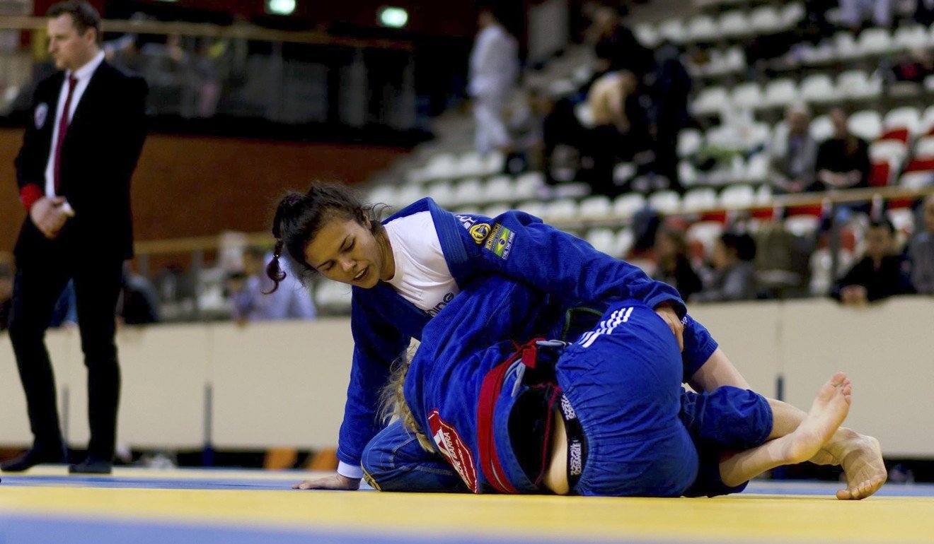 Carder (on top) competing in ju-jitsu in the Netherlands.