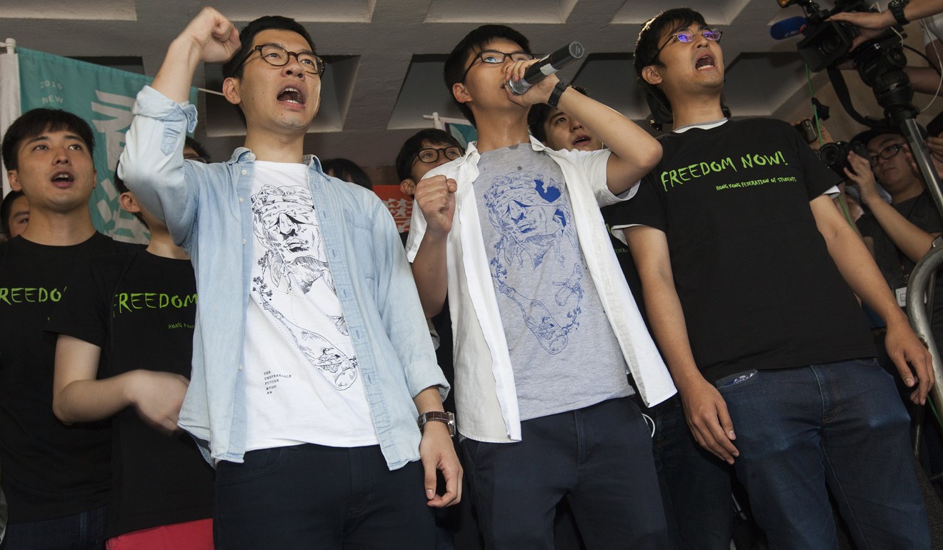 (From front row left) Activists Nathan Law, Joshua Wong and Alex Chow were jailed last month over their role in a 2014 protest. Photo: EPA