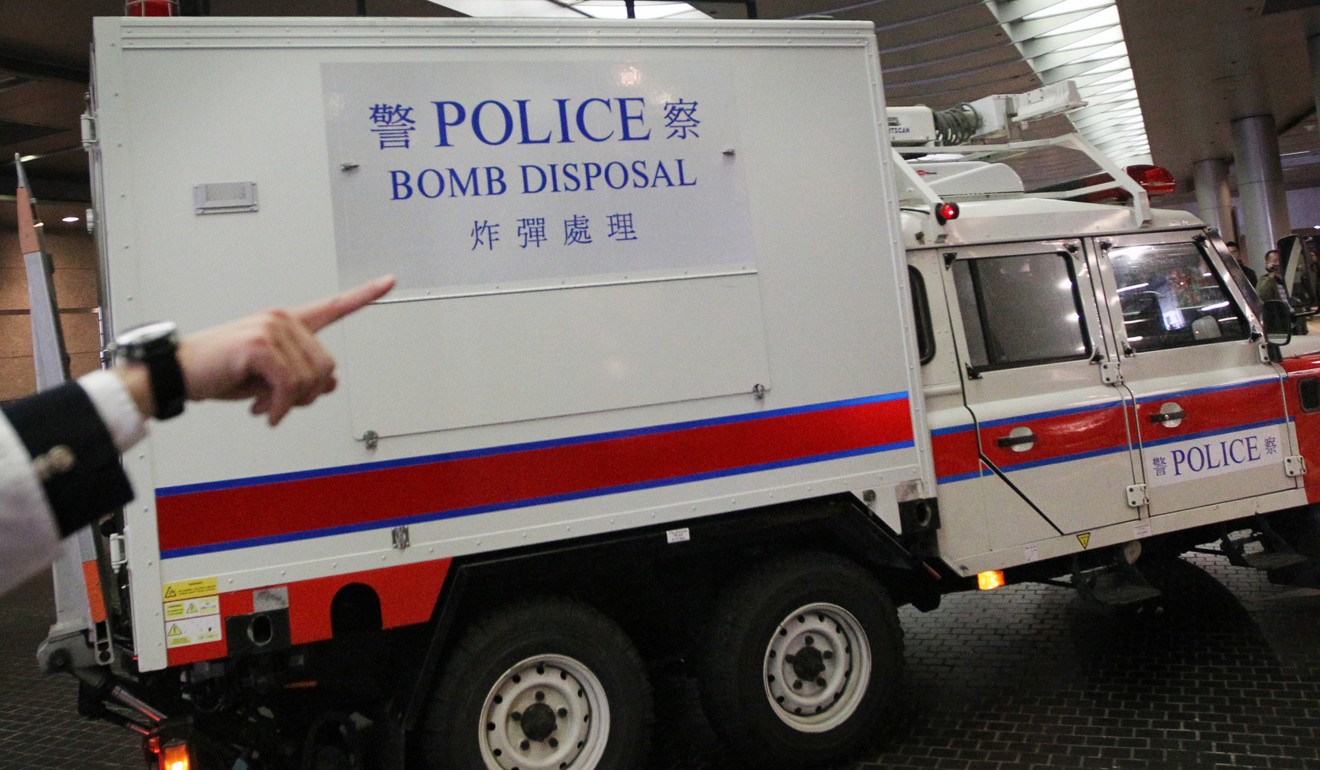 Bomb disposal officers wearing protective suits were sent to examine the powder. Photo: Sam Tsang