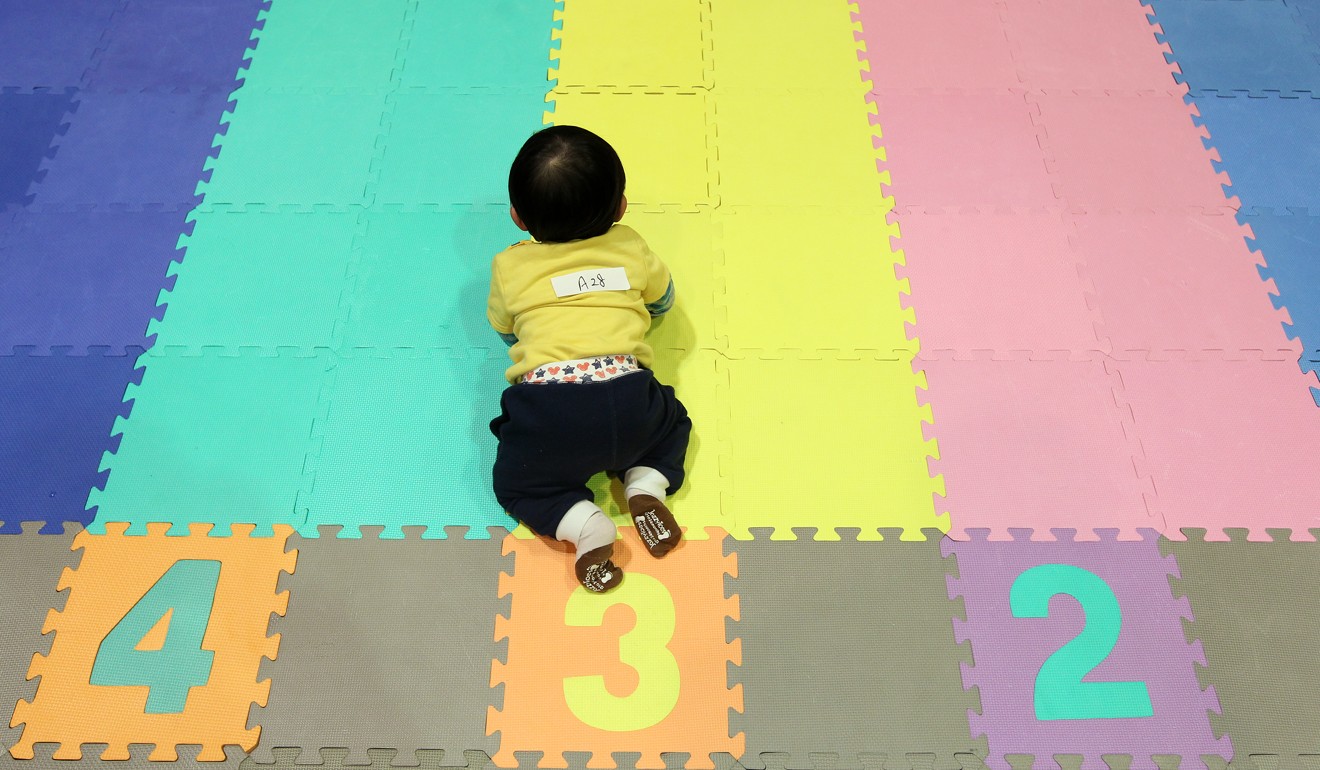 Nathan Wong takes part in a crawling contest at a baby expo at the Hong Kong Convention and Exhibition Centre in 2012. Photo: SCMP Picture