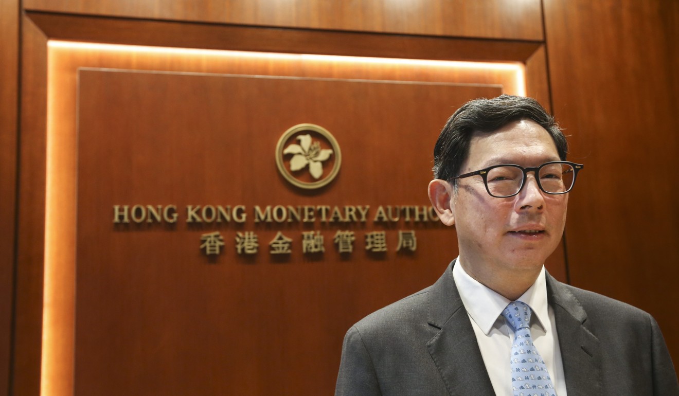 Norman Chan Tak-lam, chief executive of the Hong Kong Monetary Authority, last week indicated the government was set to review the private equity tax regulations. Photo: Dickson Lee