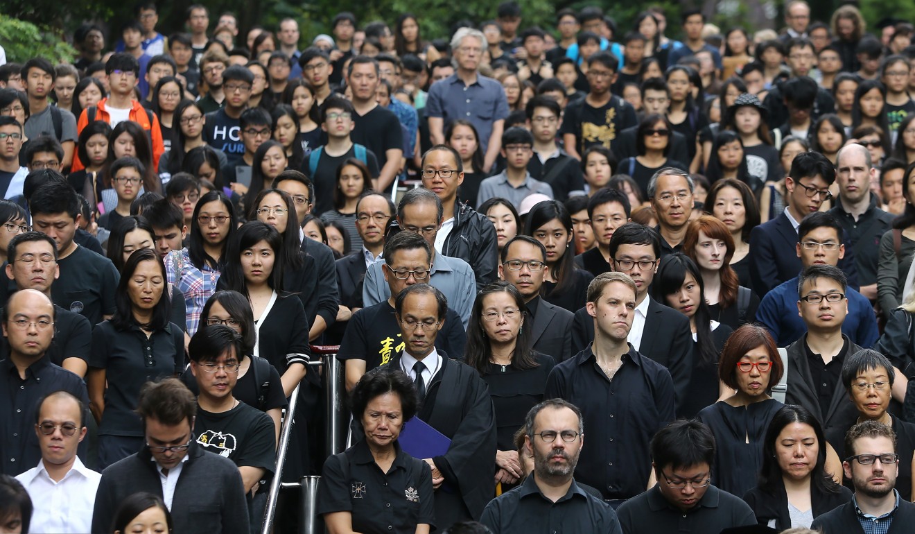 HKU staff march in a silent protest in defence of academic autonomy in October 2015 after the Professor Johannes Chan Man-mun promotion controversy. Photo: Sam Tsang