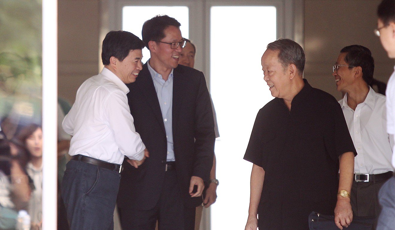 Zhang Xiaoming (centre), the new director of the State Council’s Hong Kong and Macau Affairs Office in Beijing, with his predecessor Wang Guangya (right, front) in Beijing on Friday. Photo: Simon Song