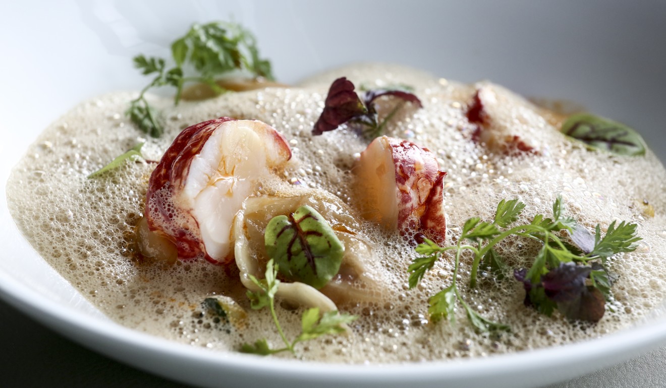 Blue lobster ravioles with herbs, vegetables and bisque broth. Photo: Jonathan Wong