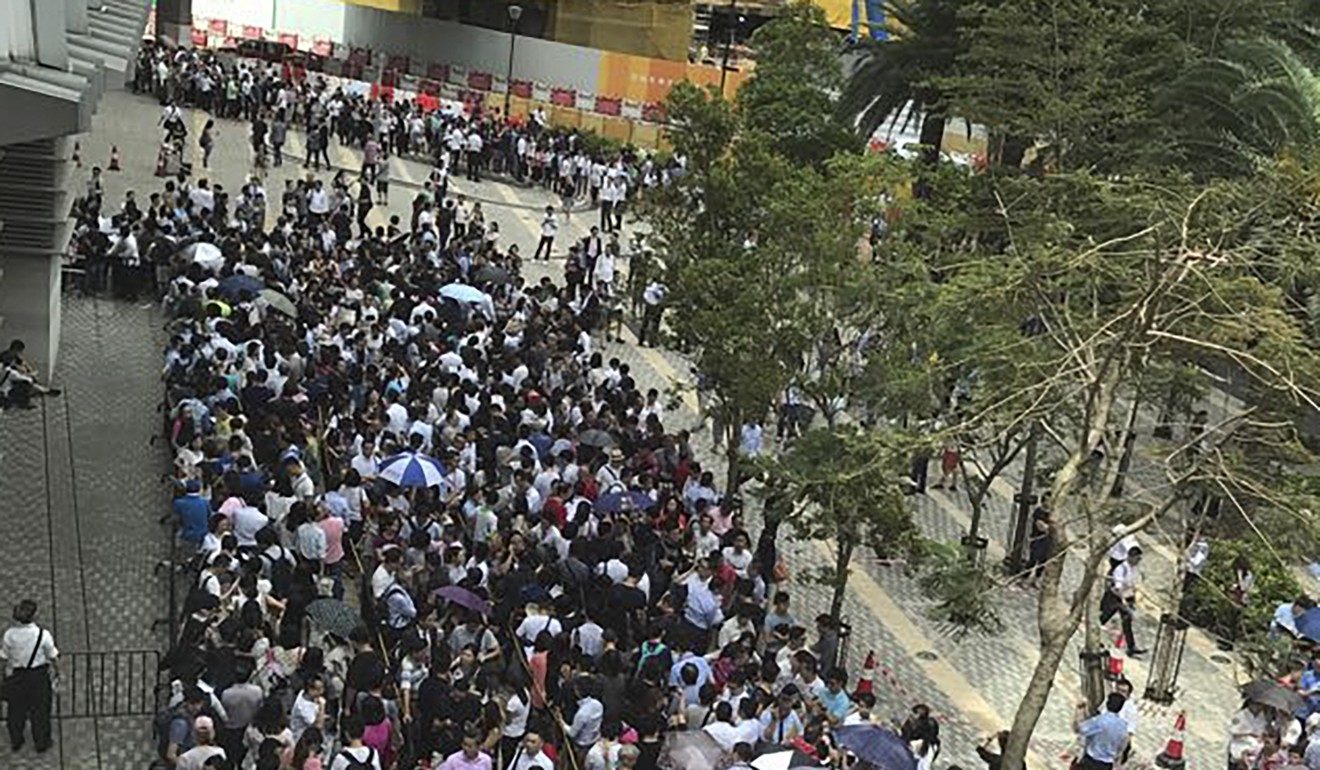 Thousands of prospective buyers queue up outside Nina Tower in Tsuen Wan to buy Parc City when the sale of 521 units. Photo: Handout