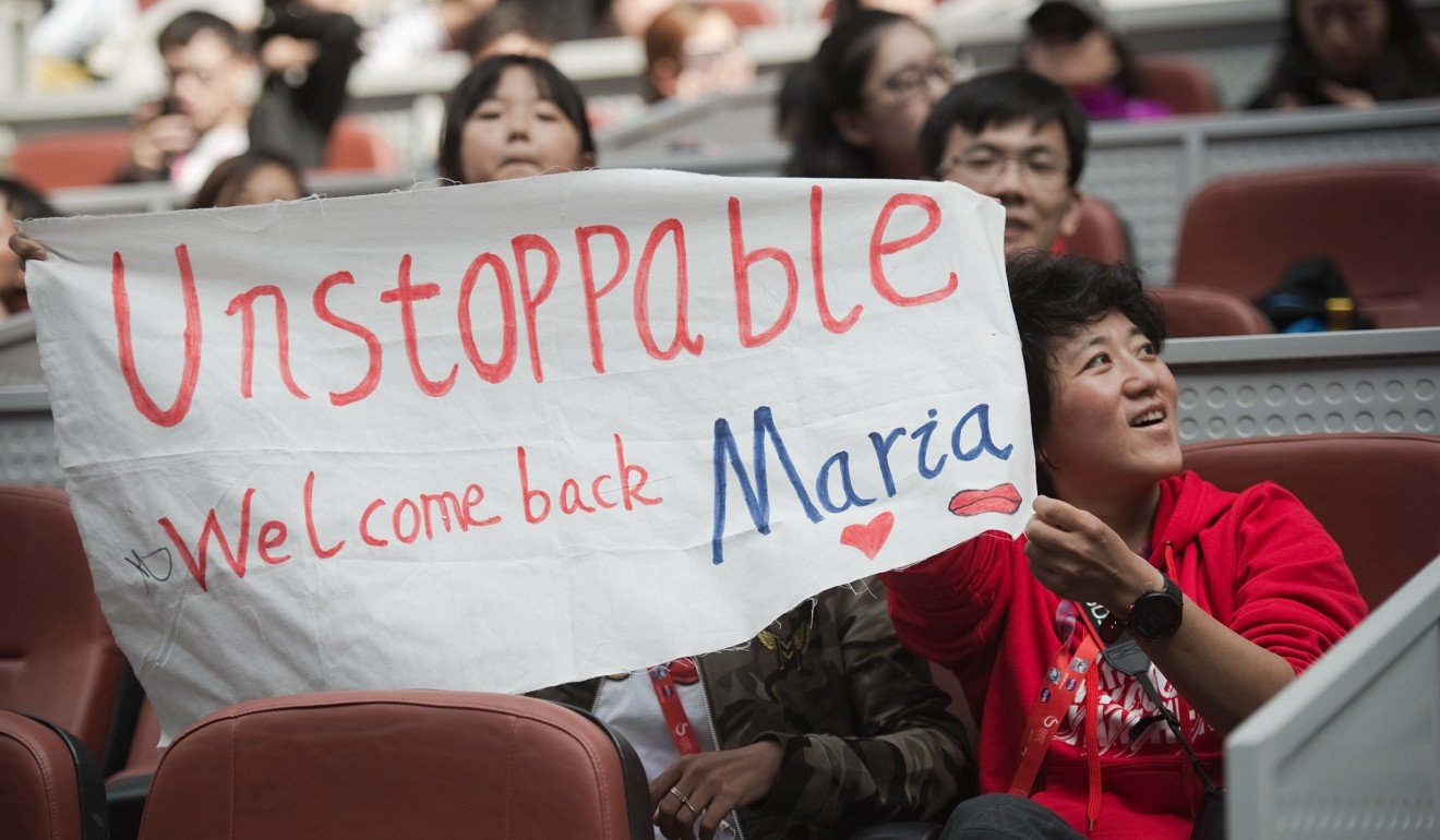 Supporters of Maria Sharapova of Russia display a banner backing their hero. Photo: AFP