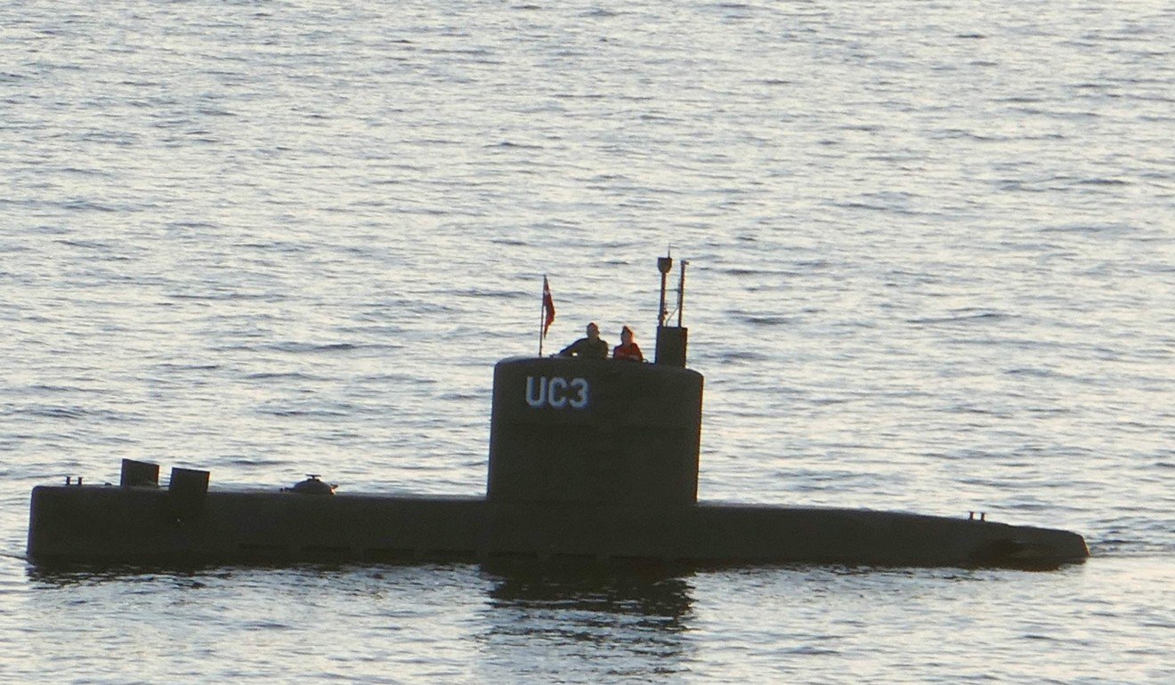 Swedish journalist Kim Wall (right) stands next to Peter Madsen in the tower of the private submarine UC3 Nautilus on August 10, 2017 in Copenhagen Harbour. Photo: AFP