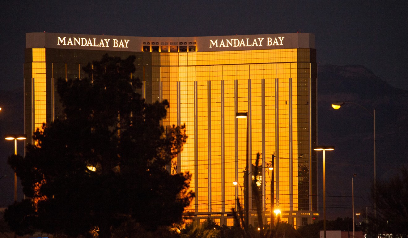 The rising sun is reflected in the Mandalay Bay Casino, following a mass shooting in which dozens were killed at the Route 91 music festival on the Las Vegas Strip on Sunday night. Photo: AP