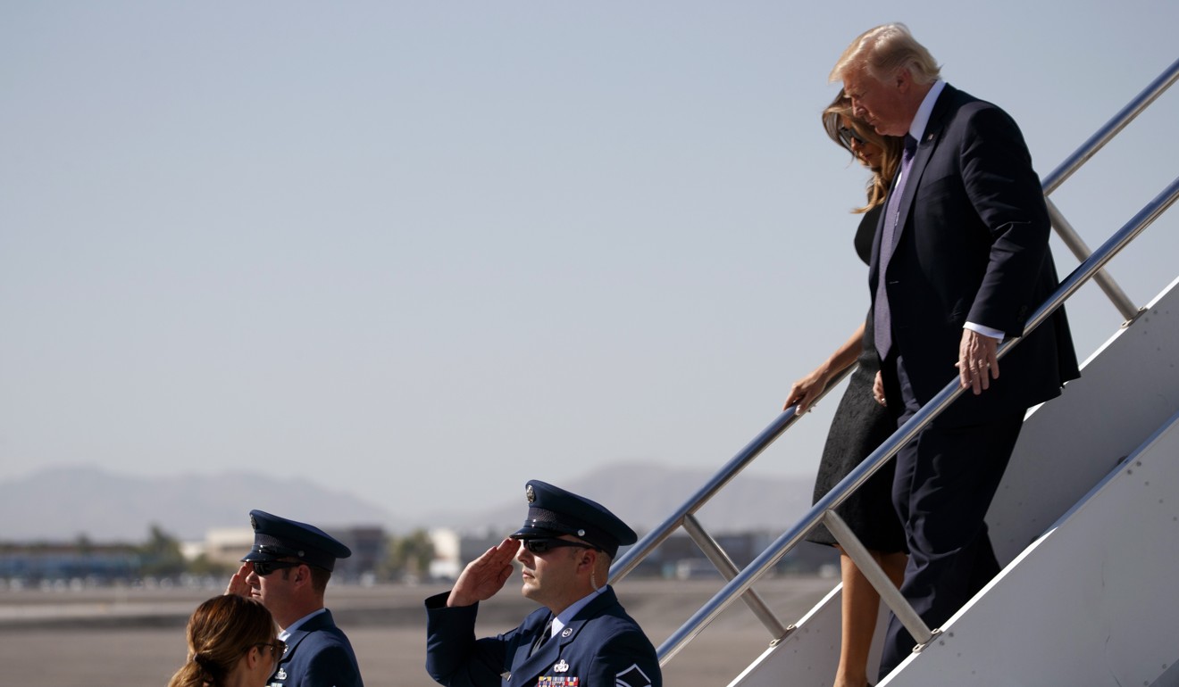 President Donald Trump and first lady Melania Trump step off Air Force One at Las Vegas McCarran International Airport as they arrive to meet with victims and first responders of the mass shooting. Photo: AP