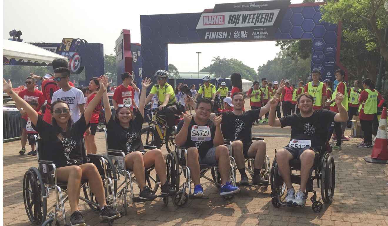 Ben Kende (right) and his able-bodied friends took part in a wheelchair race at Hong Kong Disneyland last month to raise money for the former Hong Kong international player’s latest treatment.