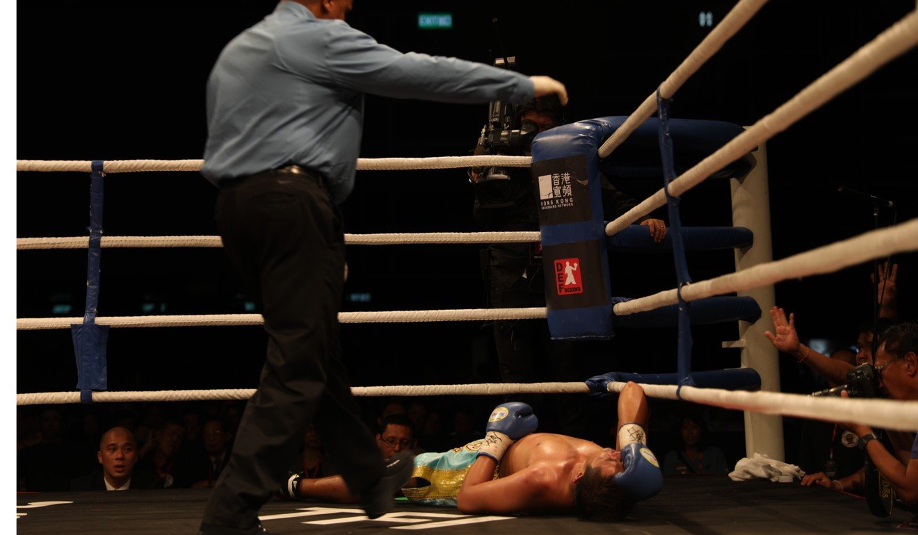 Thai boxer Korphron Sor Bangkru goes down for the count against Tom Taw. Photo: Unus Alladin