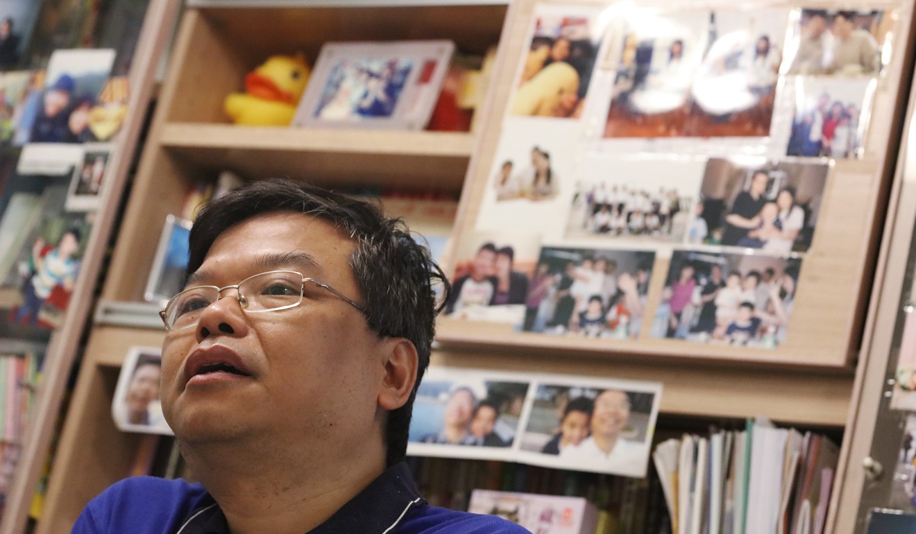 Family photos are plastered all over the living room of the Wongs’ home. Photo: Felix Wong