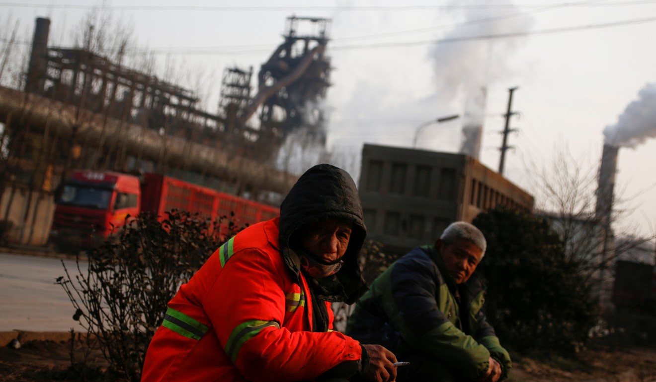 Men sit outside a steel factory in Wuan, Hebei province. The US and Europe complain about China dumping cheap steel and aluminium in their markets. Photo: Reuters