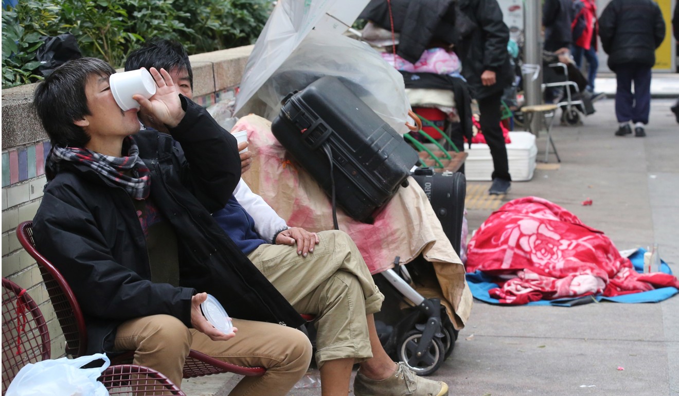 Homeless people in Yau Ma Tei endure the cold weather in January last year. Photo: Edward Wong