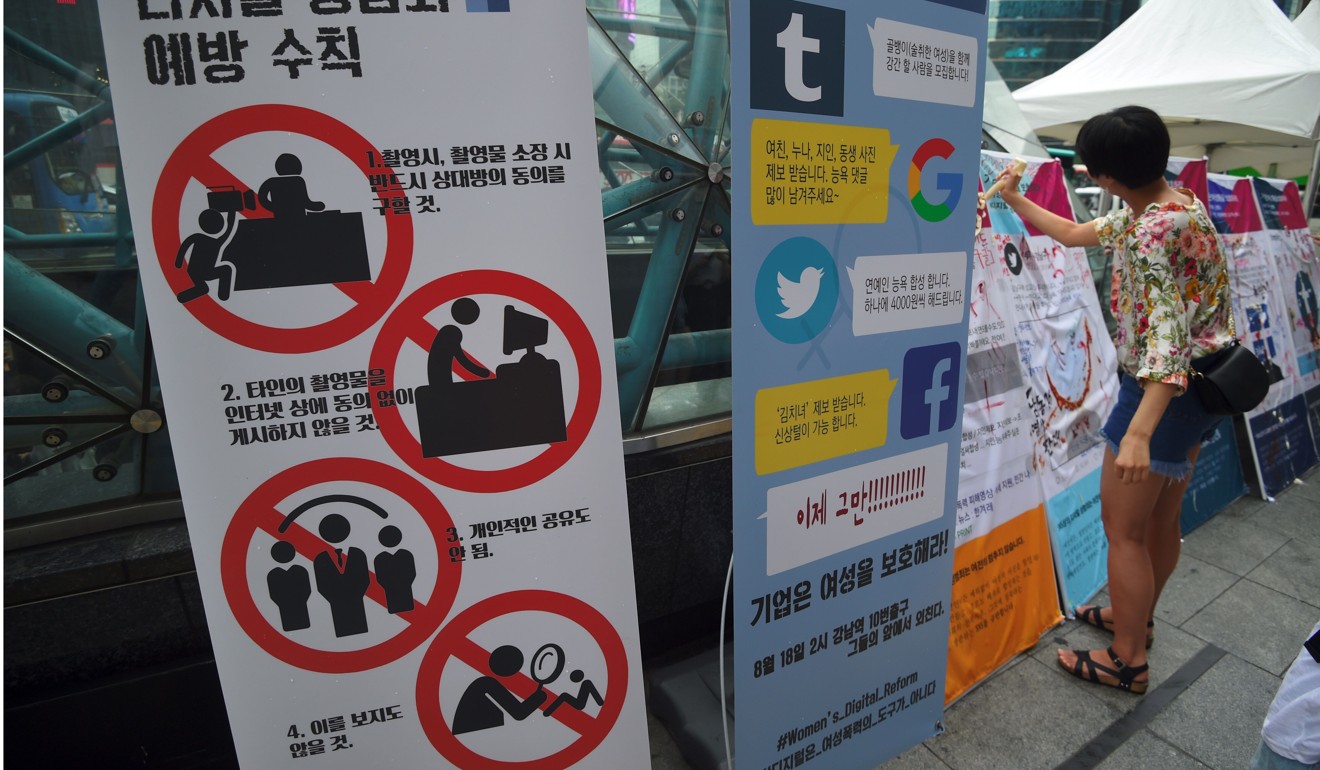 Signboards against digital sex crimes at a protest to urge tech giants including Google, YouTube, Facebook and Twitter to work harder to curb things like “revenge porn”. Photo: AFP