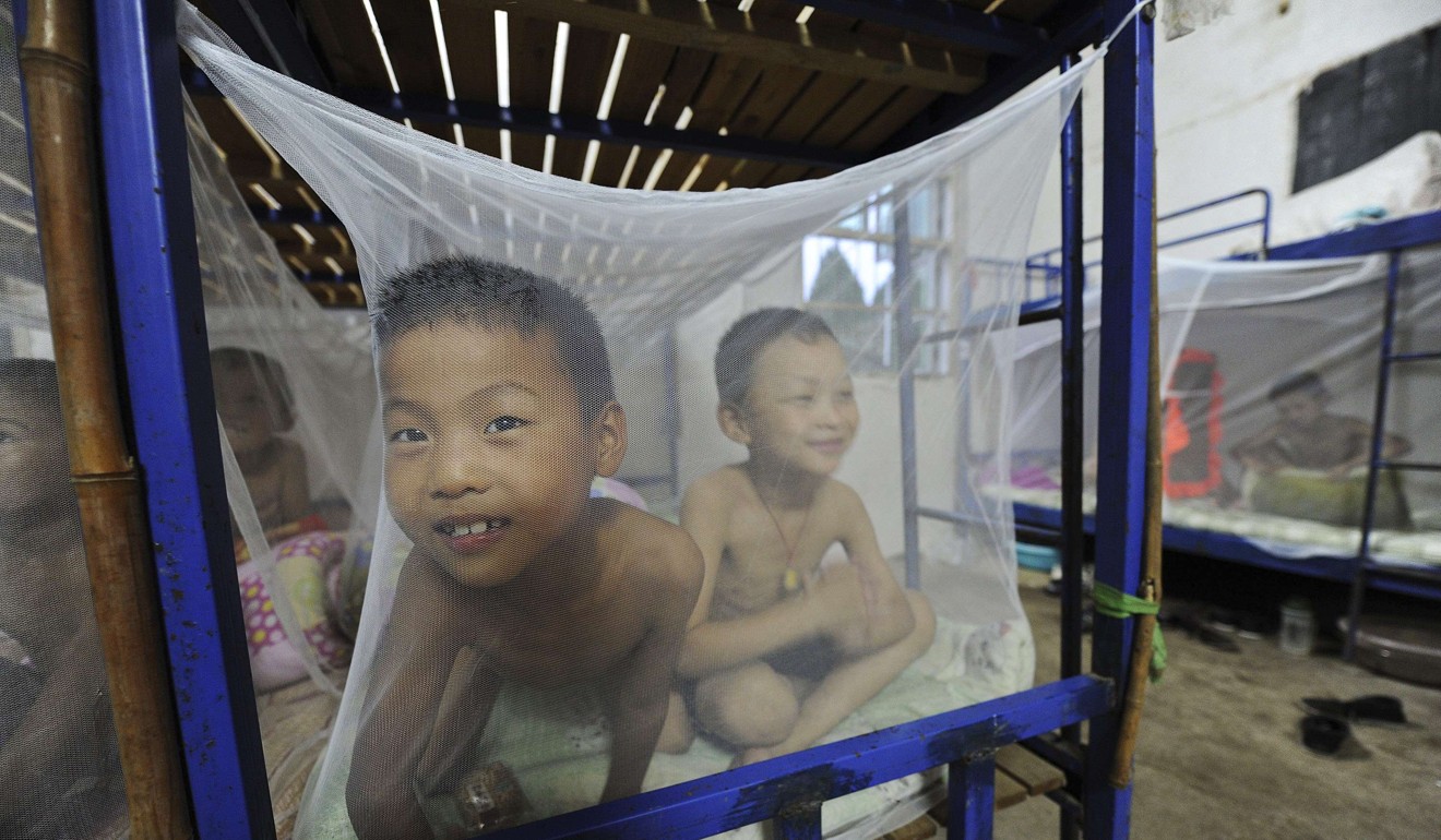 Students in Anhui province, China, use mosquito nets in 2011. The discovery more than a century ago that mosquitoes spread fever caused a spike in global demand for the nets. Photo: Reuters