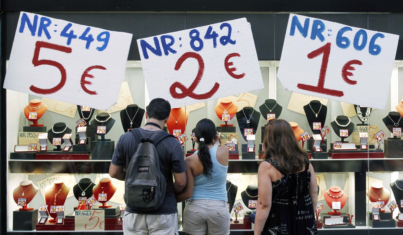 People look at a jewellery shop's window display in central Barcelona, capital of Catalonia. Catalonia represents more than one-fifth of Spain’s GDP. Photo: Reuters