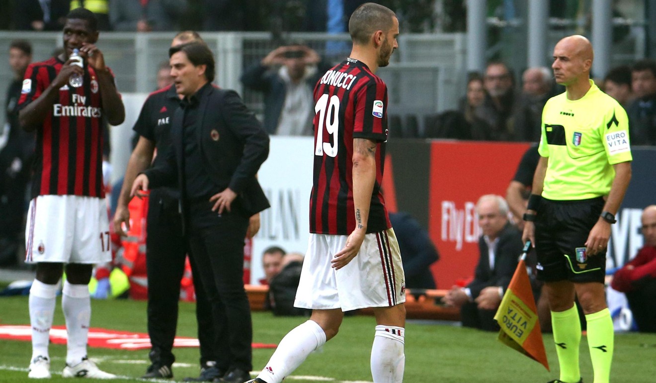 Bonucci leaves the pitch after receiving a red. Photo: EPA