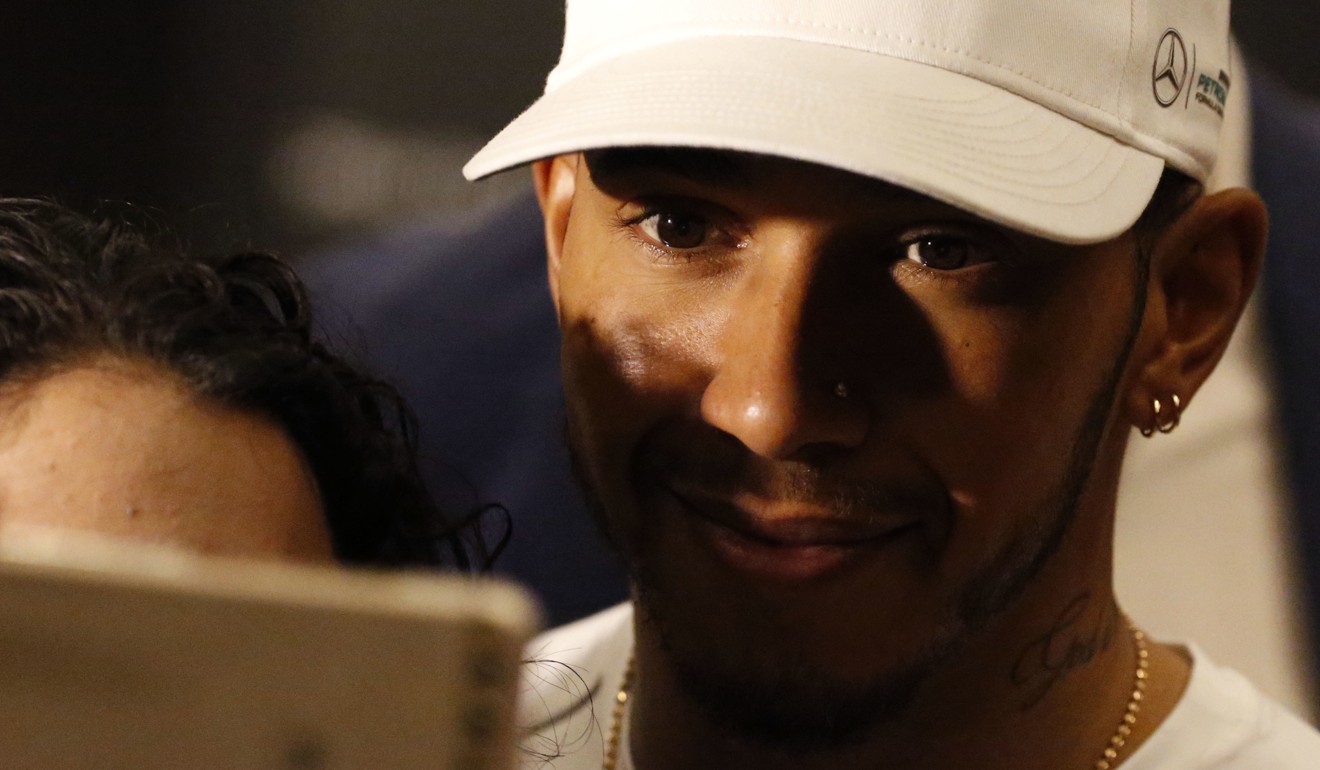 Lewis Hamilton poses for a selfie after giving a press conference in Mexico City. Photo: AP
