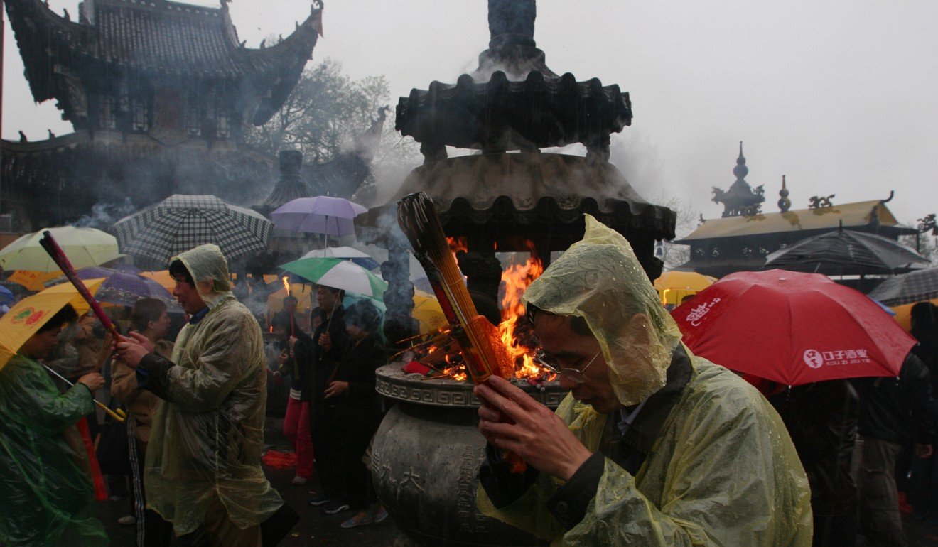 Worshippers congregate at a temple at the top of Jiuhuashan, one of the four sacred mountains in Chinese Buddhism. Photo: Robert Ng