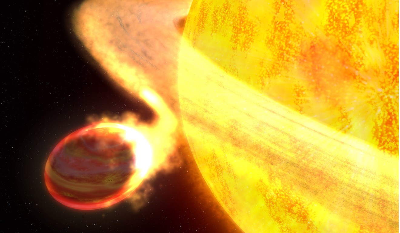 The hottest known planet in the Milky Way galaxy may also be its shortest-lived world. The doomed planet is being eaten by its parent star, according to observations made by a new instrument on NASA's Hubble Space Telescope, the Cosmic Origins Spectrograph (COS). The planet may only have another 10 million years left before it is completely devoured.The planet, called WASP-12b, is so close to its sunlike star that it is superheated to nearly 2,800 degrees Fahrenheit and stretched into a football shape by enormous tidal forces. The atmosphere has ballooned to nearly three times Jupiter's radius and is spilling material onto the star. The planet is 40 per cent more massive than Jupiter. Photo: AFP