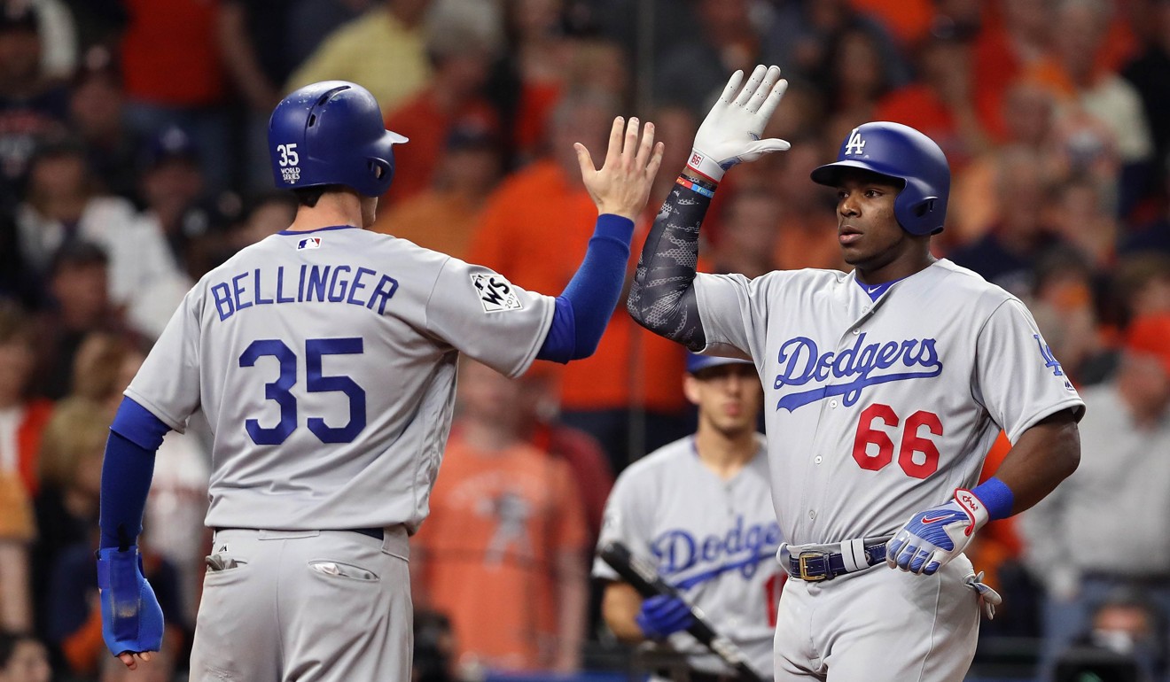 Yasiel Puig of the Los Angeles Dodgers celebrates hitting a two-run homer during the ninth inning. Photo: AFP
