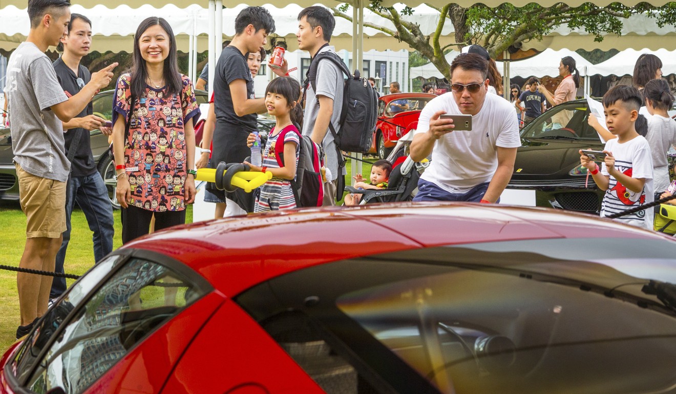 Motoring enthusiasts flock around the cars at last year’s festival. Photo: Black Cygnus