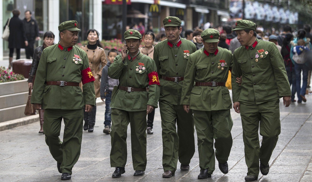 Sino-Vietnamese war veterans wear their old uniforms in the centre of Kunming, Yunnan province, in November 2013, when more than 30 protested about local government neglect of veterans’ welfare. Photo: Reuters