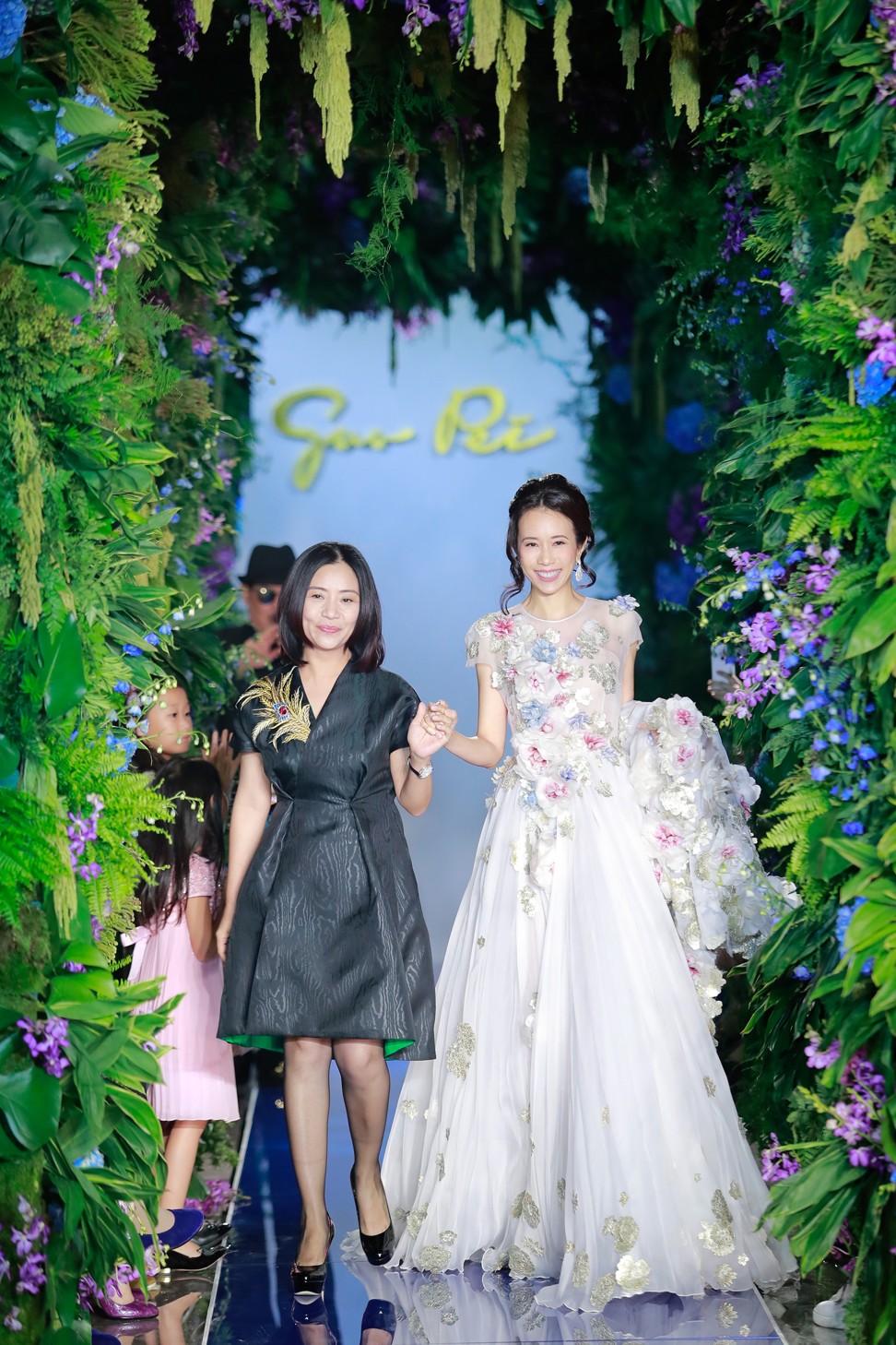 Karen Mok wearing a magnificent gown designed by Guo Pei.
