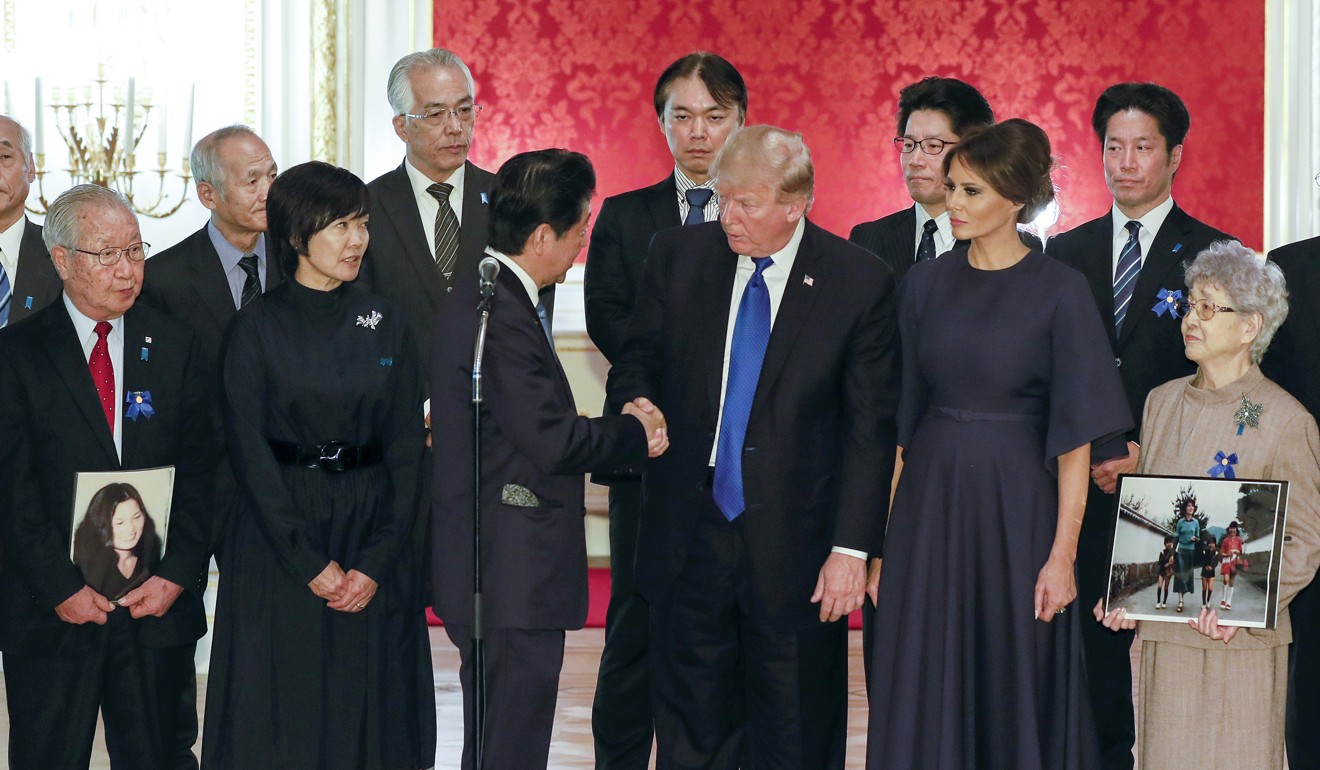 Trump and Abe meet families of Japanese abducted by North Korea. Photo: AP
