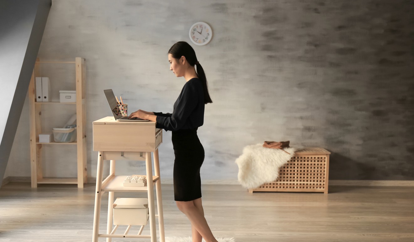 Working at a standing desk burns many more calories than sitting. Photo: Shutterstock