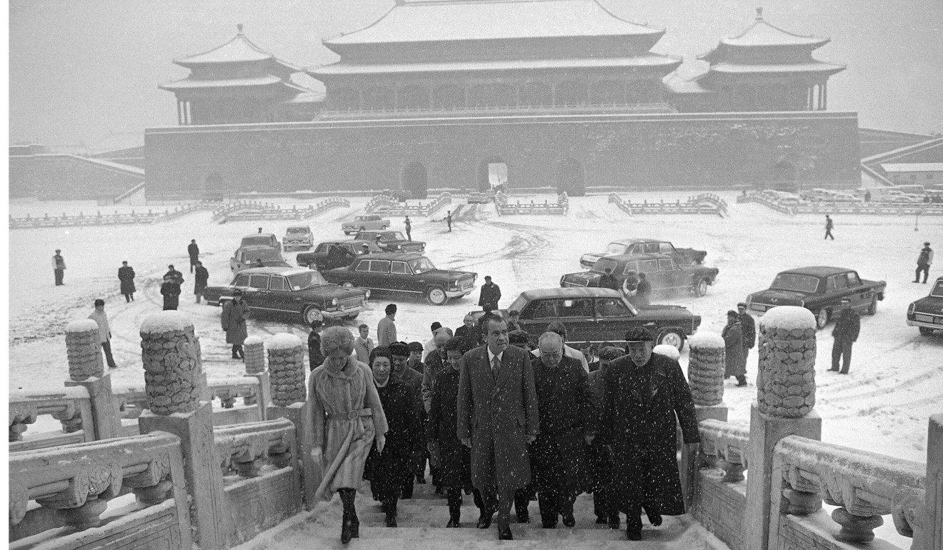 Former US president Richard Nixon (centre) enters the palace grounds of Beijing's Forbidden City in 1972. Photo: AP