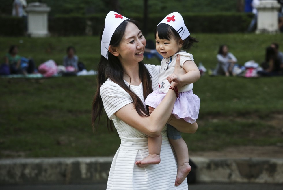 Yelly Chui Nga-lee with her 11 months old daughter Bella Wong, pose for photographs at Tsing Yi Park in Tsing Yi. Yelly recently set up a mother’s club to promote blood donations. 29OCT17 SCMP / Jonathan Wong